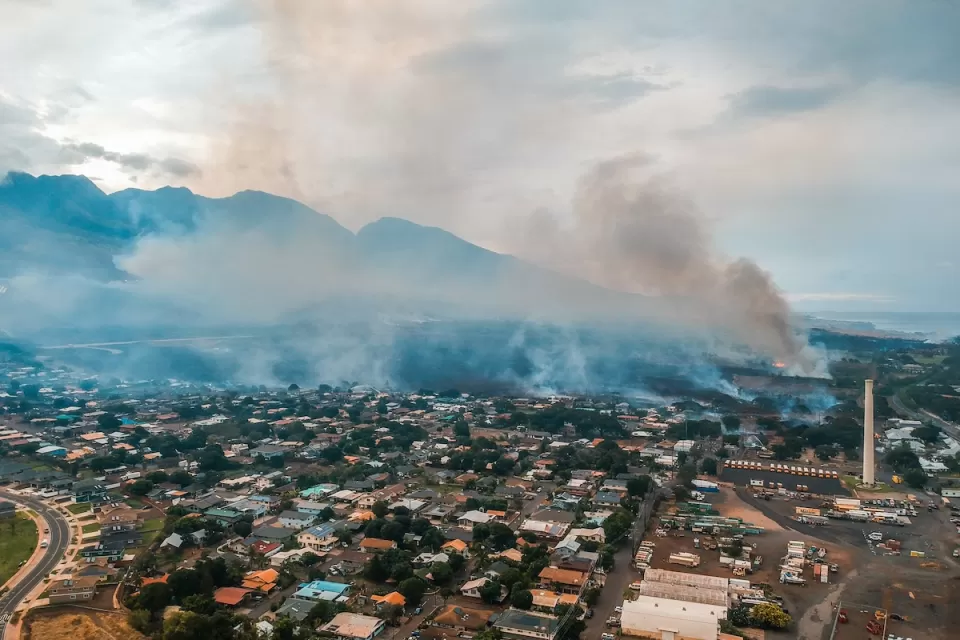 Aerial view of Lahainaluna neighborhood with smoke from fires in Maui, Hawaii.